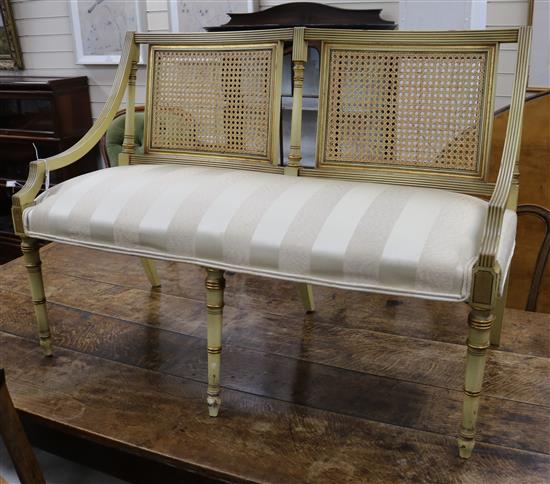A French style parcel gilt cream painted canape w.101cm